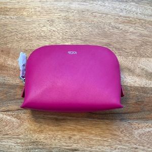 Fuschia TUMI leather travel cosmetic pouch